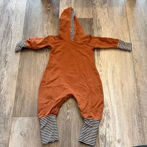 Caribou Rust Hooded Baby One-Piece with Black & White Stripe Trim